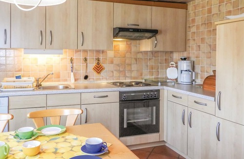 Neugalmsbull House | This quaint thatched house was made into a cozy vacation home for 4 people without losing the typica