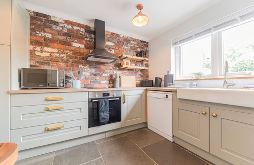 Cark Cottage | This warm and welcoming cottage, with a homely feel, has a balcony where you can watch ducks go by.