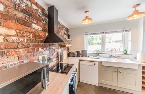 Cark Cottage | This warm and welcoming cottage, with a homely feel, has a balcony where you can watch ducks go by.