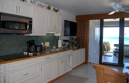 Red Hook Condo | "THREE PALMS"~ Directly ON beach, remodeled, private patio, pool, quiet & clean