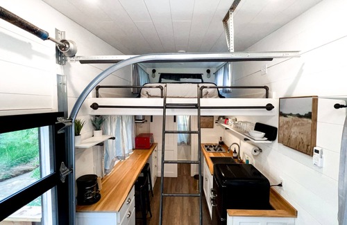 Montrose House | Tiny home located beside a creek.