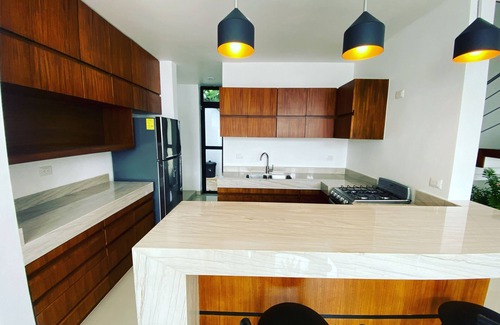 Tizimin House | Tizimín retreat: stylish townhouses, natural harmony, modern comforts.