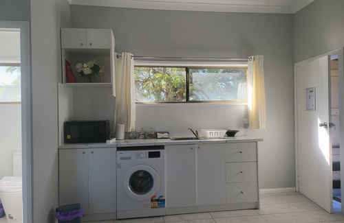 Windsor Apartment | Top View Deluxe Self-Contained Room No 3 with Balcony Overlooking Swimming Pool.