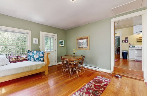 Molalla Cottage | Tranquil landscape with riverside firepit, gas grill, gas fireplace, and deck