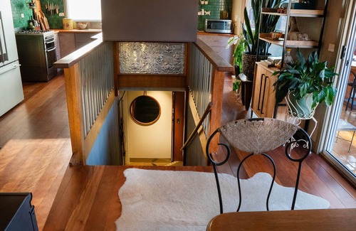 Tawonga South Apartment | Tree Tops Apt @ Dreamers features log fire, mountain + pool views thru tree tops