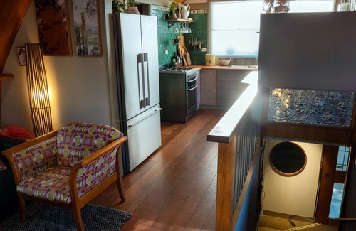 Tawonga South Apartment | Tree Tops Apt @ Dreamers features log fire, mountain + pool views thru tree tops