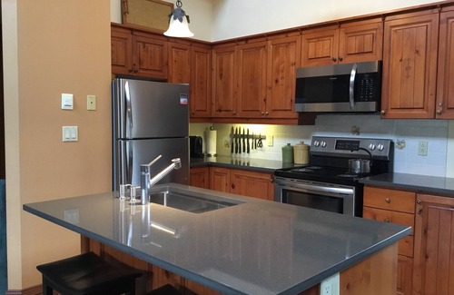 Mont-Tremblant Condo | Tremblant, on resort, ski in & out, 4 bedroom, sleeps 8, skating rink + fire pit