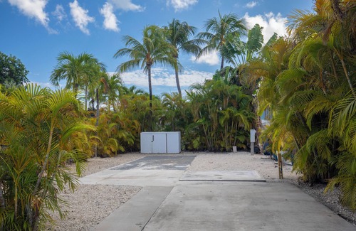 Cudjoe Key RV Rental | Tropical RV Lot Oasis in the Florida Keys with Paved Patio, Full Hookups & Palm-Tree Privacy