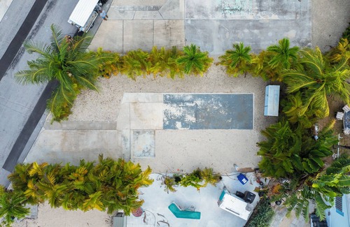 Cudjoe Key RV Rental | Tropical RV Lot Oasis in the Florida Keys with Paved Patio, Full Hookups & Palm-Tree Privacy