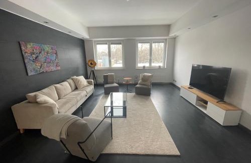 Langenhorn Apartment | TruRetreats Design Loft für 8 Personen I Riesige Küche I eCharger I 65z SmartTV I 150qm