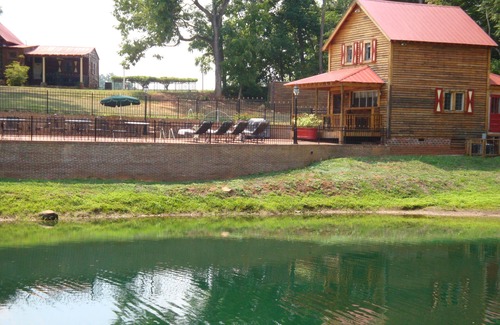 Pittsboro House | Two story cottage on 62 acre Het Landhuis estate