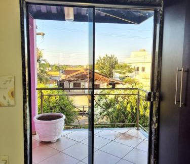 Porto Velho House | Um quarto na Casa Rosa