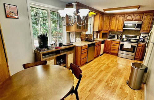 Federal Way House | Unit surrounded by treesnWasher and Dryer + Pet friendly!
