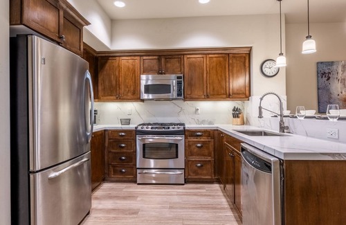 Woodwinds House | Updated Woodwinds Townhome! Walk to the Village! 2 Car Garage! 2 Decks!