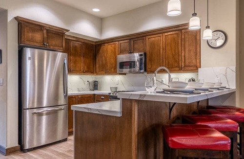 Woodwinds House | Updated Woodwinds Townhome! Walk to the Village! 2 Car Garage! 2 Decks!