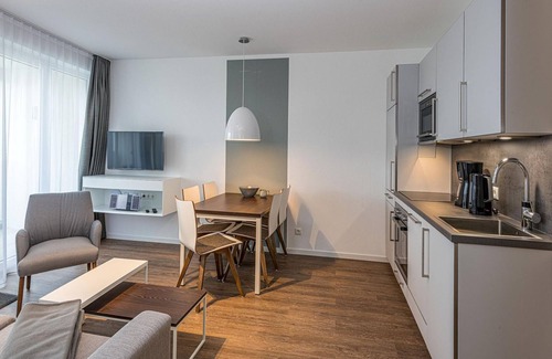 Bensersiel Apartment | Vacation apartment close to the beach with balconies, parking, use of swimming pool & sauna