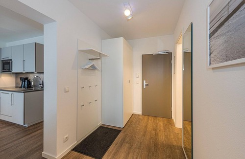 Bensersiel Apartment | Vacation apartment close to the beach with balconies, parking, use of swimming pool & sauna
