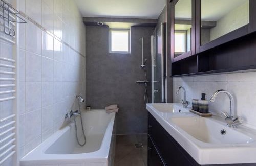 Andijk House | Villa in Friesland with Garden by Water