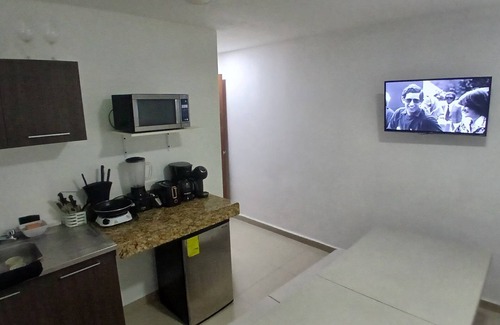 Downtown Cancun Hotel | Villa Leo Beautiful room with shared kitchenette, in the heart of Cancun