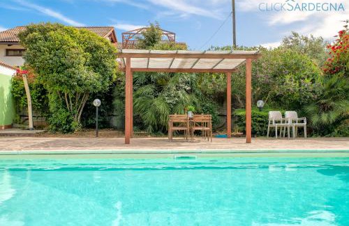 Porto Torres Villa | Villa Melograno with exclusive swimming pool surrounded by greenery