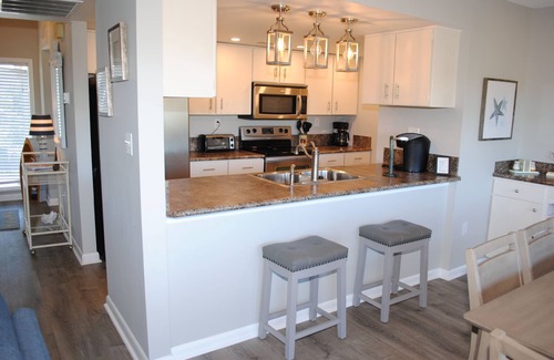 Litchfield by the Sea Condo | Villa with marsh views and pool access located within gated Litchfield By the Sea community.