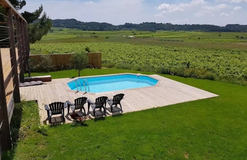 Plaissan Villa | Villa wood Lodge terrace pilotis, swimming pool, exceptional view vineyards, classified 3*.