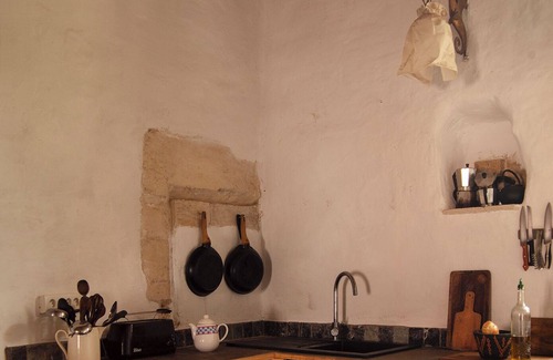 Meynes House | Village house in its original state (under the bell tower)