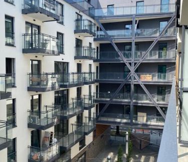 Praga Apartment | Warsaw Okrzei Apartment - City Center via pedestrian bridge