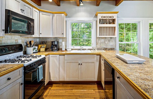 Eddington House | Water-view home with dock, fireplace, central AC & washer/dryer - dog-friendly