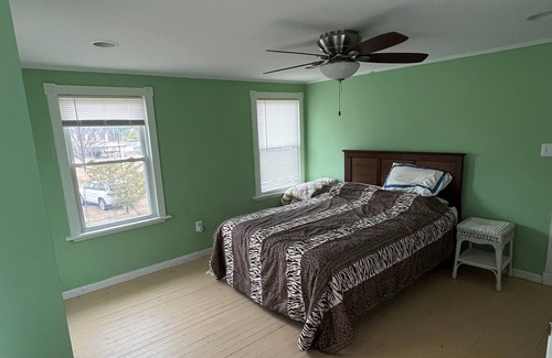 Piney Point House | Waterfront cottage with private pier, fireplace, and large yard.