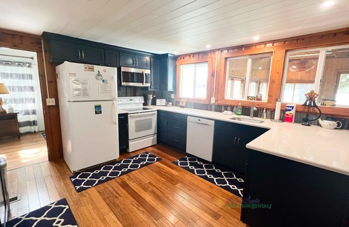 Lake Leelanau Cabin | Waterfront home and guest cottage on Lake Leelanau. Pet ok. Sleeps 11.