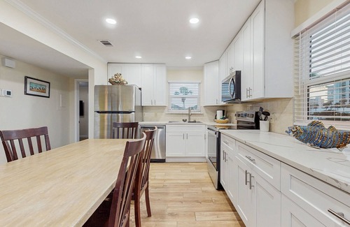 Holiday Isle Villa | Waterfront villa with multi level home, shared pool & easy beach access