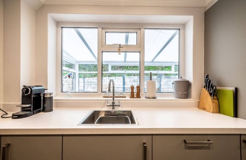 Ebford House | Waterside retreat with estuary views and balcony