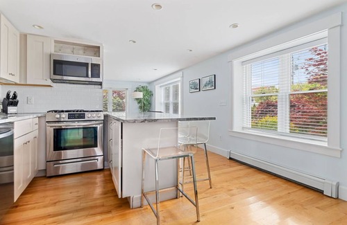 Provincetown Condo | West End 2 BR 2 BA with bonus queen sleep sofa, private farmers porch & parking