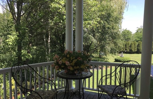 Williston North House | Williston Village INN- Brass room with King size Bed for two people