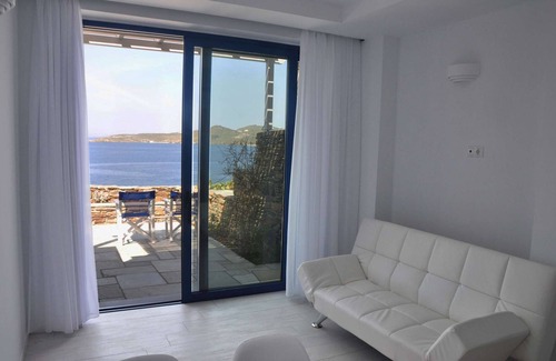 Tinos House | Windmill and houses by the sea // Stavros Bay