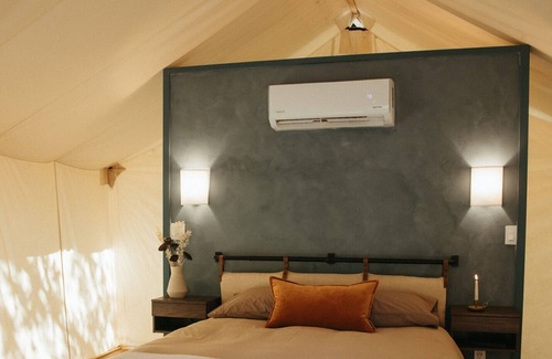 Prairie Lea RV Rental | Wooded retreat space with glamping tents, container homes & tons of amenities!