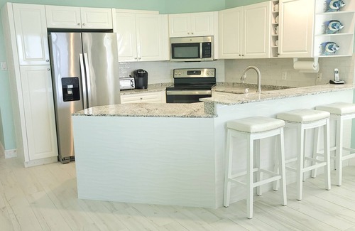 Old Man Bay Condo | YOU'VE Arrived! Beachfront 3BR condo w/Pool-Relax. North Side near Rum Point
