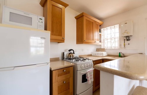 Blue Waters Hotel | Your Home Away from Home by Rockley Beach; Pool, Gardens & Full Kitchen