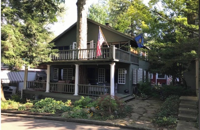 100 YEAR OLD MAPLE TREE GROWING THROUGH FRONT PORCH