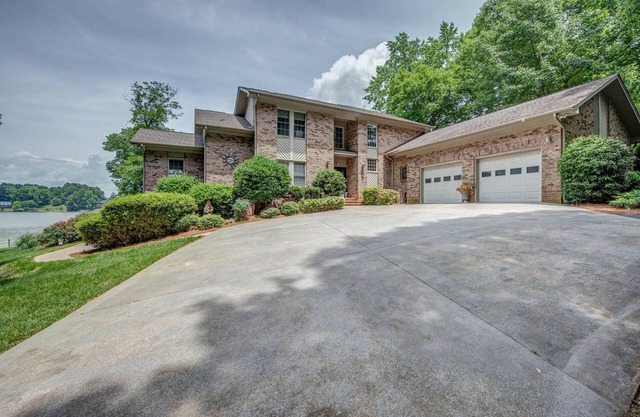 180 degree lake view, 300 ft. of shoreline, heated pool, and private beach.