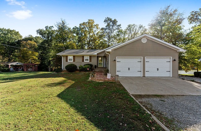 3 bedroom/2 full bath lakefront home with gentle slope to private covered dock