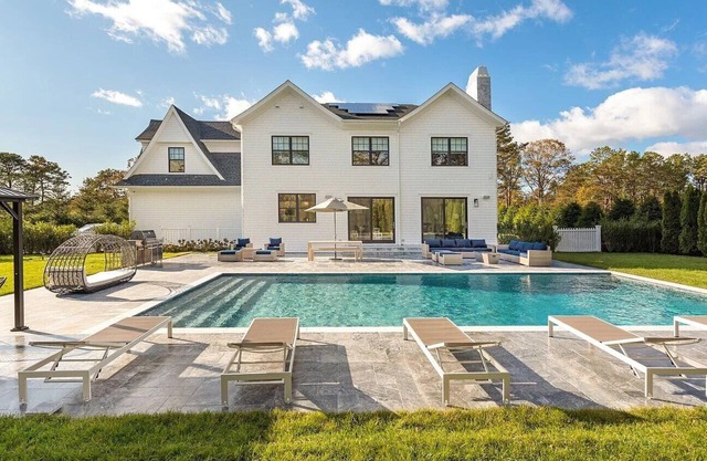 6,400 square foot traditional-style home with a private pool and sweeping.