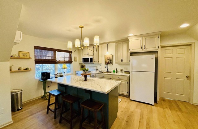 A charming cottage, recently renovated in a serene wooded area of Hanceville, AL