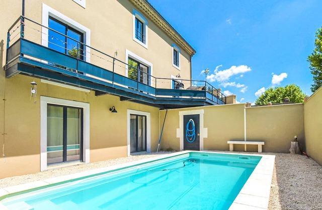 A charming domicile with outdoor pool and spacious living area.
