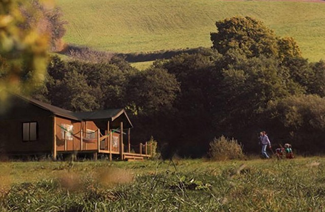 A home from home canvas-wrapped three bedroom colonial style tent.