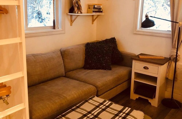 A quaint loft style apartment located by trails in the forest.