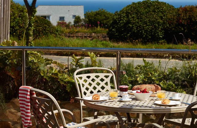 A two-bedroom modern and sleek apartment with sea views and an outdoor terrace.