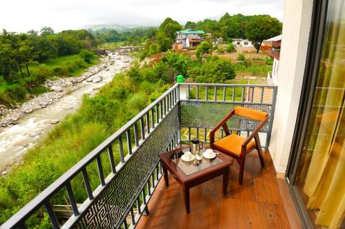 Aachman River and Valley View Resort Dharamshala - A riverside resort with balcony view