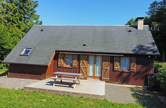 All-inclusive wooden chalet with terrace at forest's edge